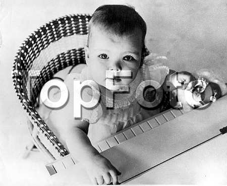 1958_Caroline and piano.jpg