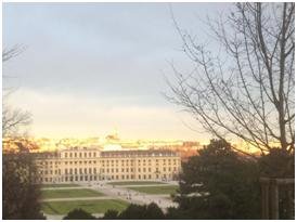 Schonbrunn just before sunset with Vienna skyline.jpg