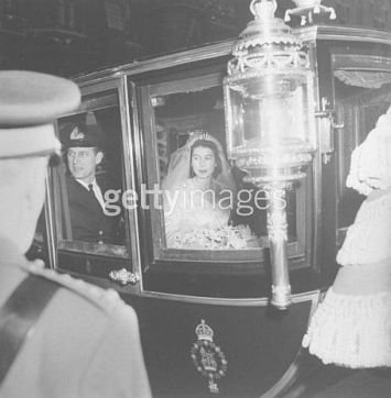 Elizabeth and Philip in coach after wedding.jpg