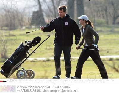 CPly couple playing golf.jpg