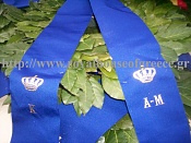 Close-up of ribbon, showing initials