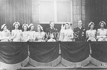 Elizabeth with wedding party and husband on balcony.jpg