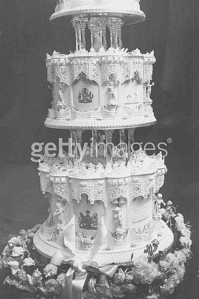 Elizabeth wedding cake detail - scenes from their lives are on bottom two tiers.jpg