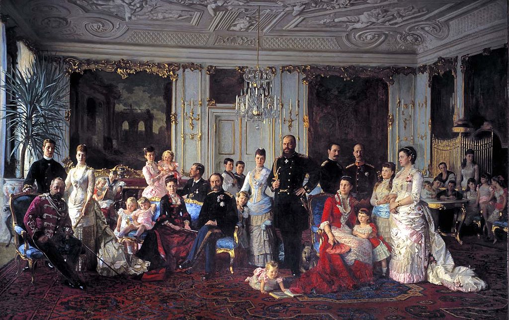 1024px-Christian_IX_of_Denmark_with_family_%28Tuxen%29.jpg